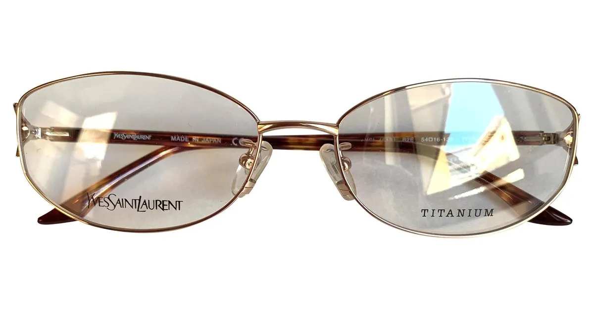 Yves Saint Laurent Monturas de titanio YSL Gold hardware 