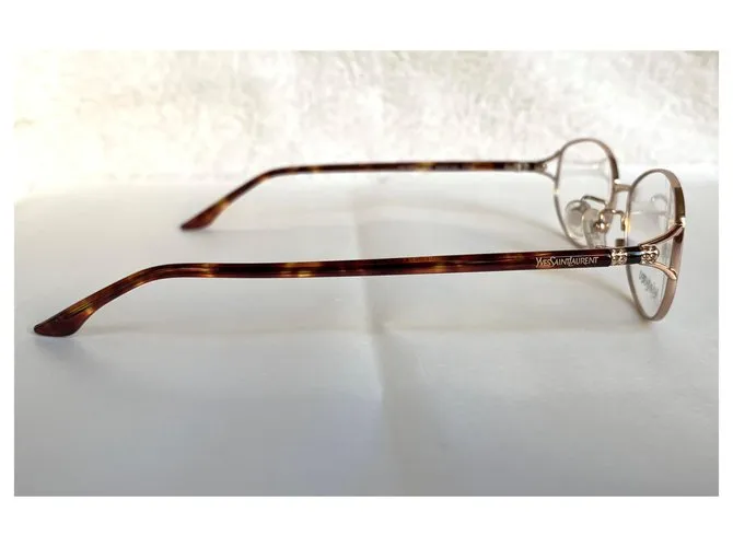 Yves Saint Laurent Monturas de titanio YSL Gold hardware 