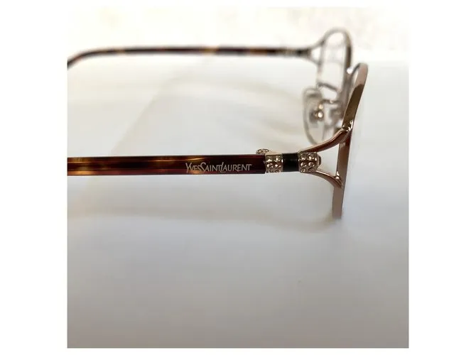 Yves Saint Laurent Monturas de titanio YSL Gold hardware 