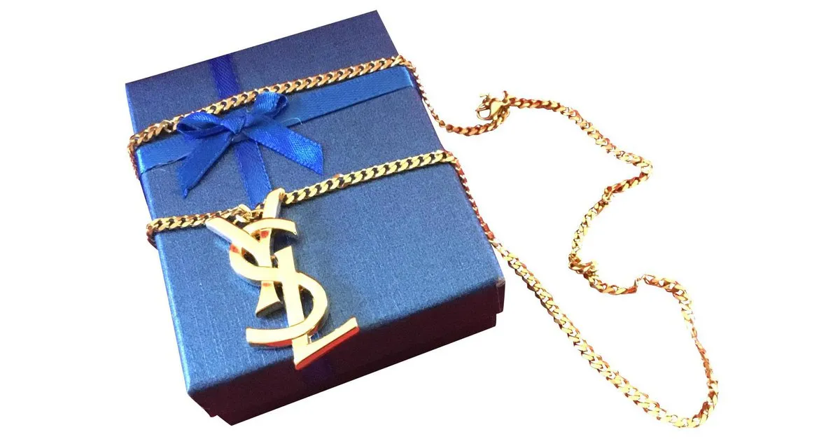 Yves Saint Laurent YSL ENTRELAZADO DURANTE Gold hardware 